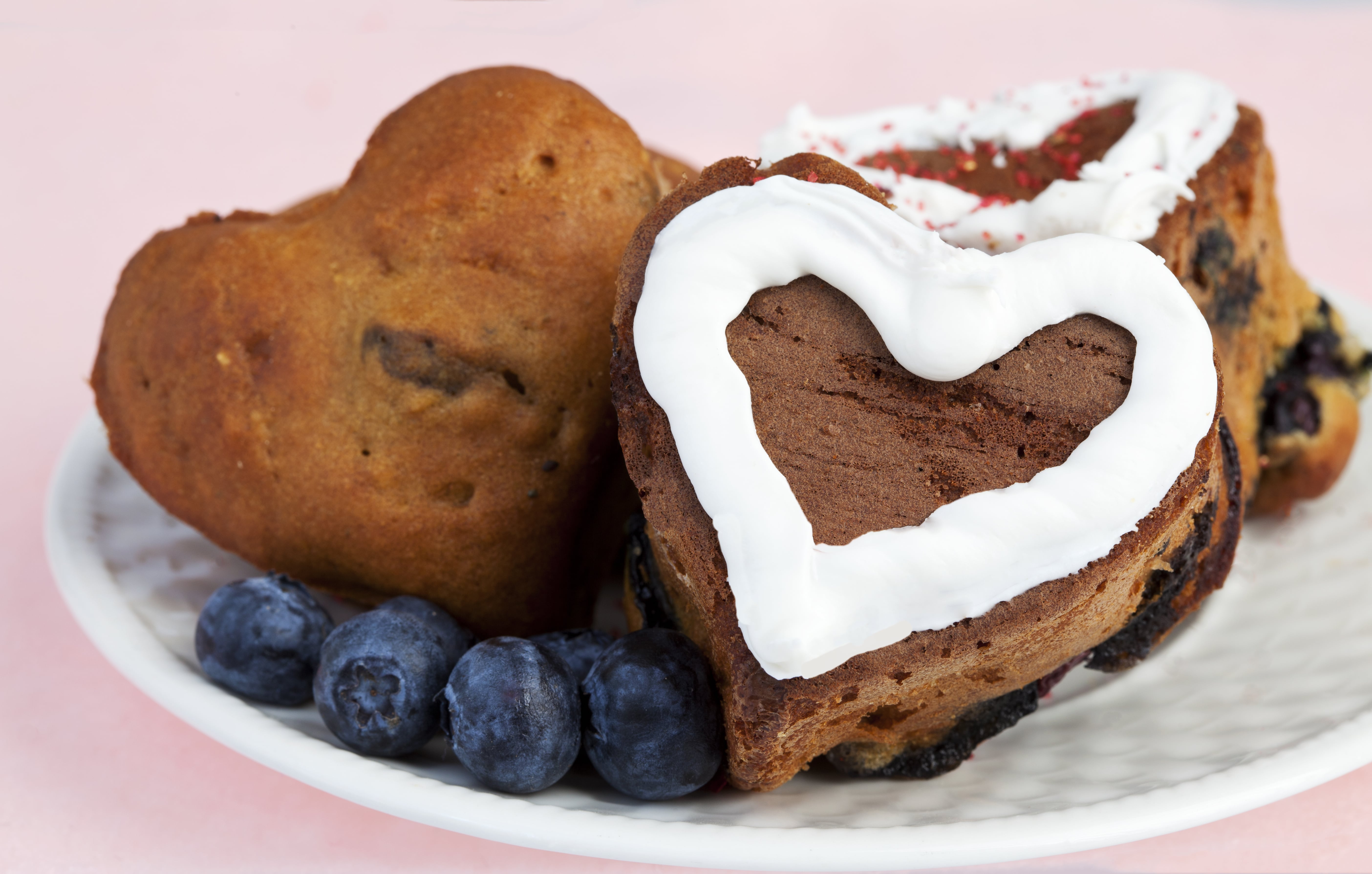 Heart-shaped baked goods with blueberries