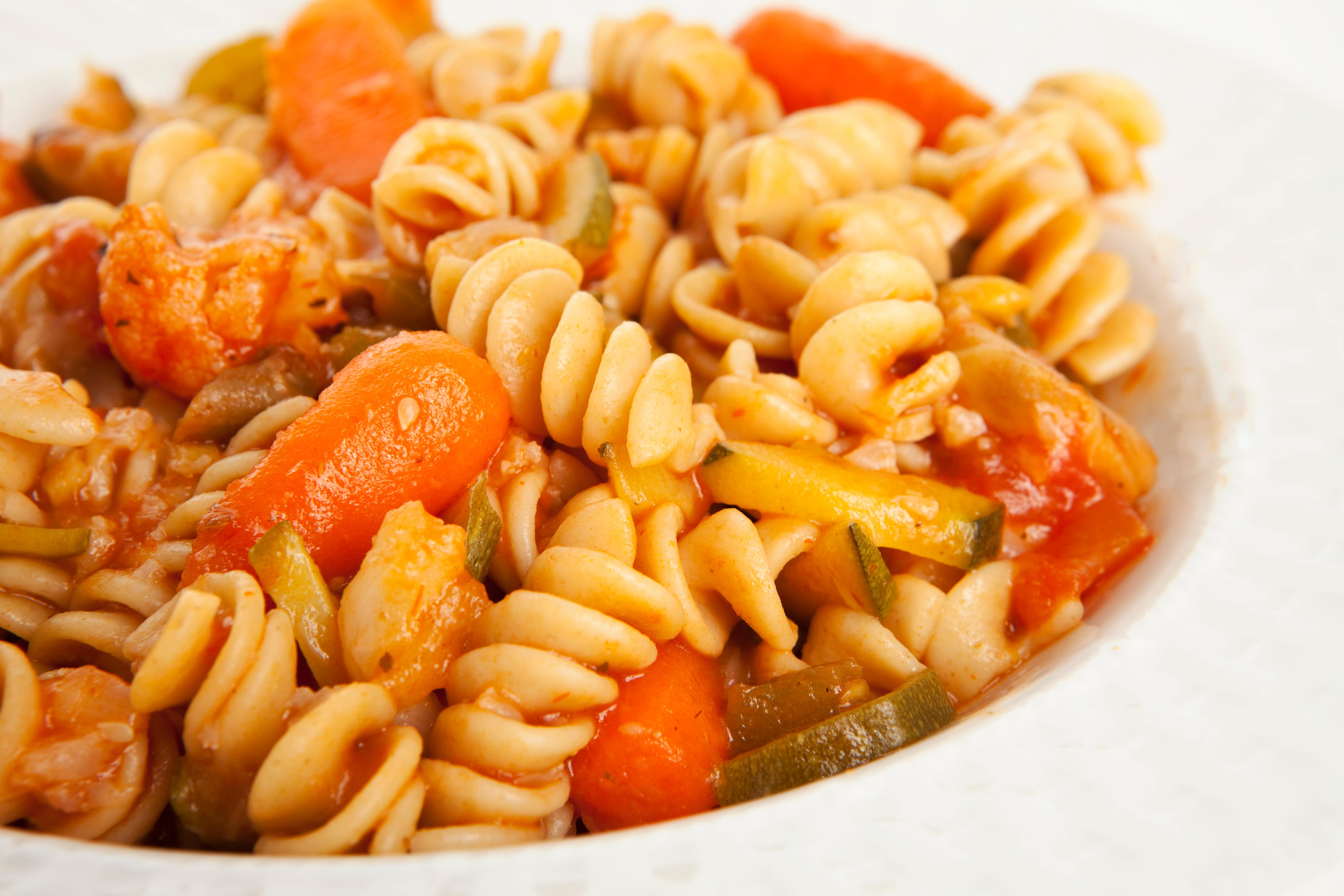 Pasta with vegetables in tomato sauce.