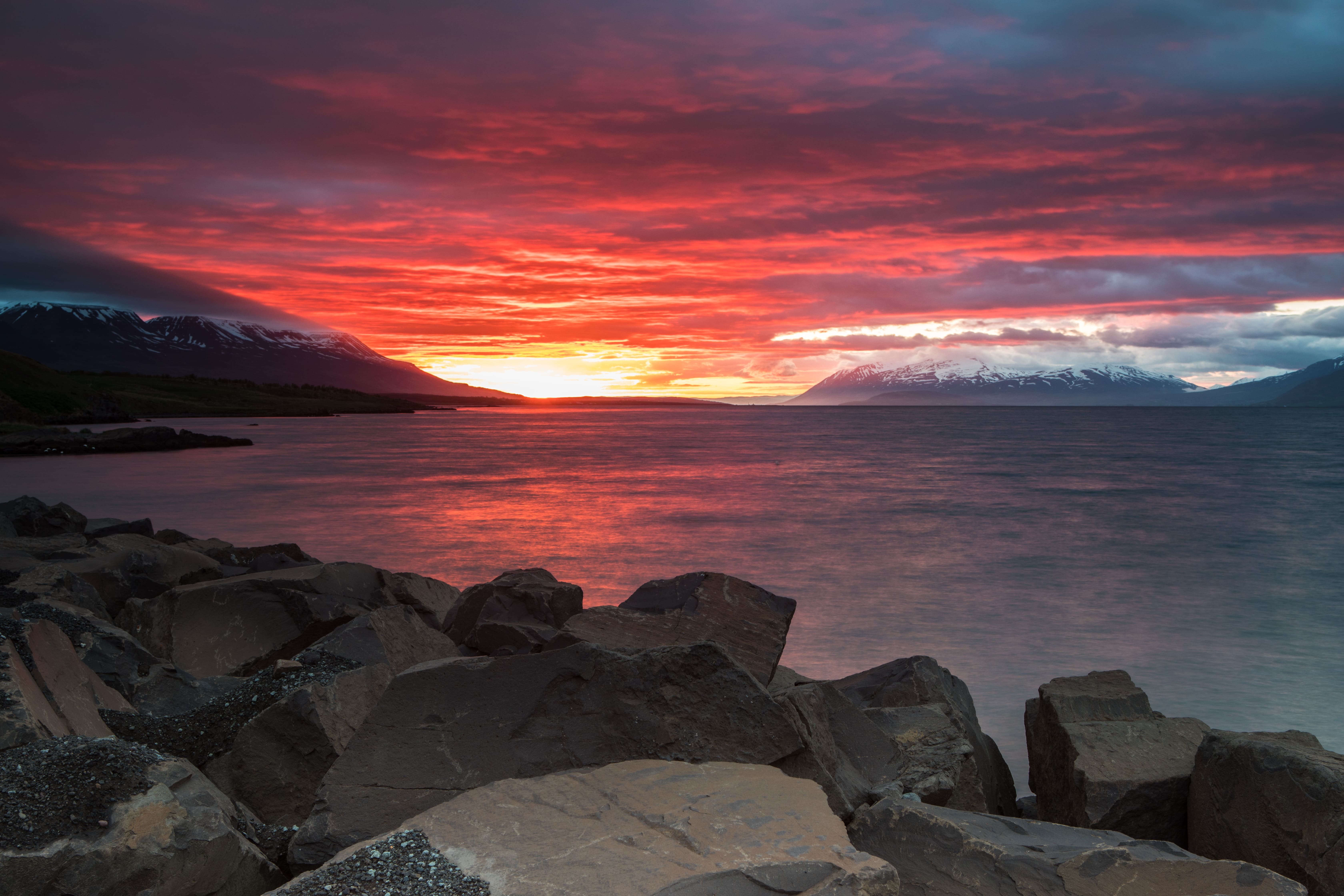 Fiery Icelandic sunset over Akureyri fjord, Iceland