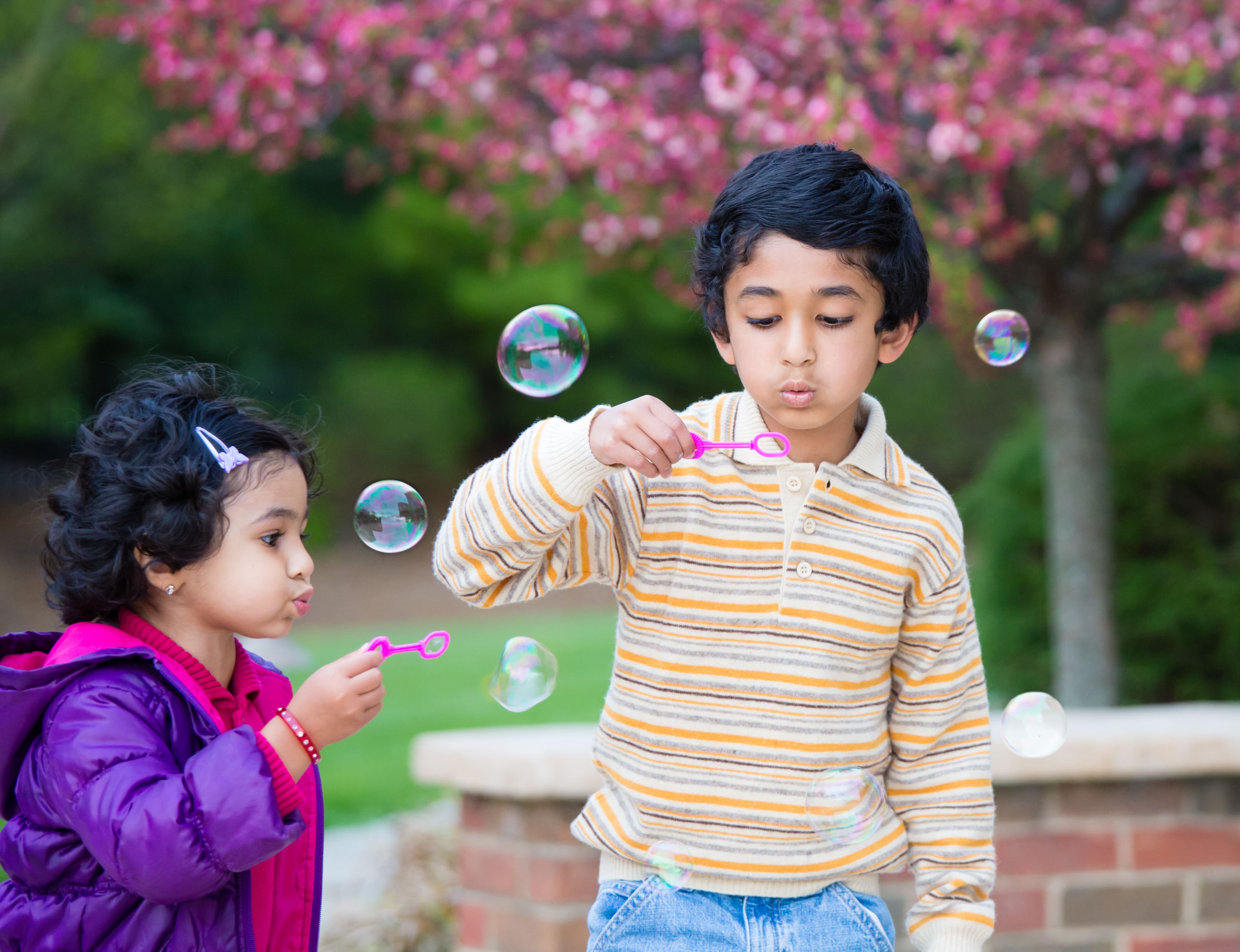Kids blowing bubbles